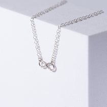 Infinity Sterling Silver Necklace on White Background 