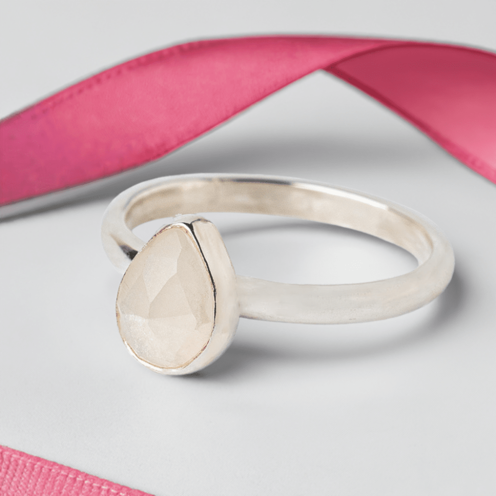 Handmade Sterling Silver Moonstone Pear Gemstone Ring on a white background with a pink ribbon.