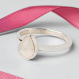 Handmade Sterling Silver Moonstone Pear Gemstone Ring on a white background with a pink ribbon.
