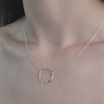 Model wearing Lunar Necklace in a video