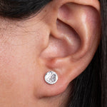 Sterling Silver Round shaped Hammered Textured Earrings worn on models ear lobe