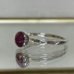 Ruby Sterling Silver Hammered Textured Stacking Ring side view on a mirror background