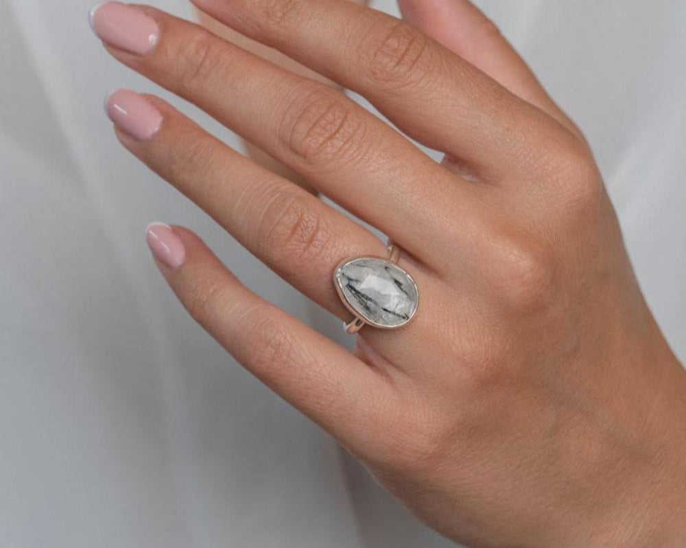 Handmade Sterling Silver Rutilated Black Quartz Statement Ring worn on model's left hand.