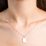 Sterling Silver Necklace with a rectangle shaped pendent worn on a model.