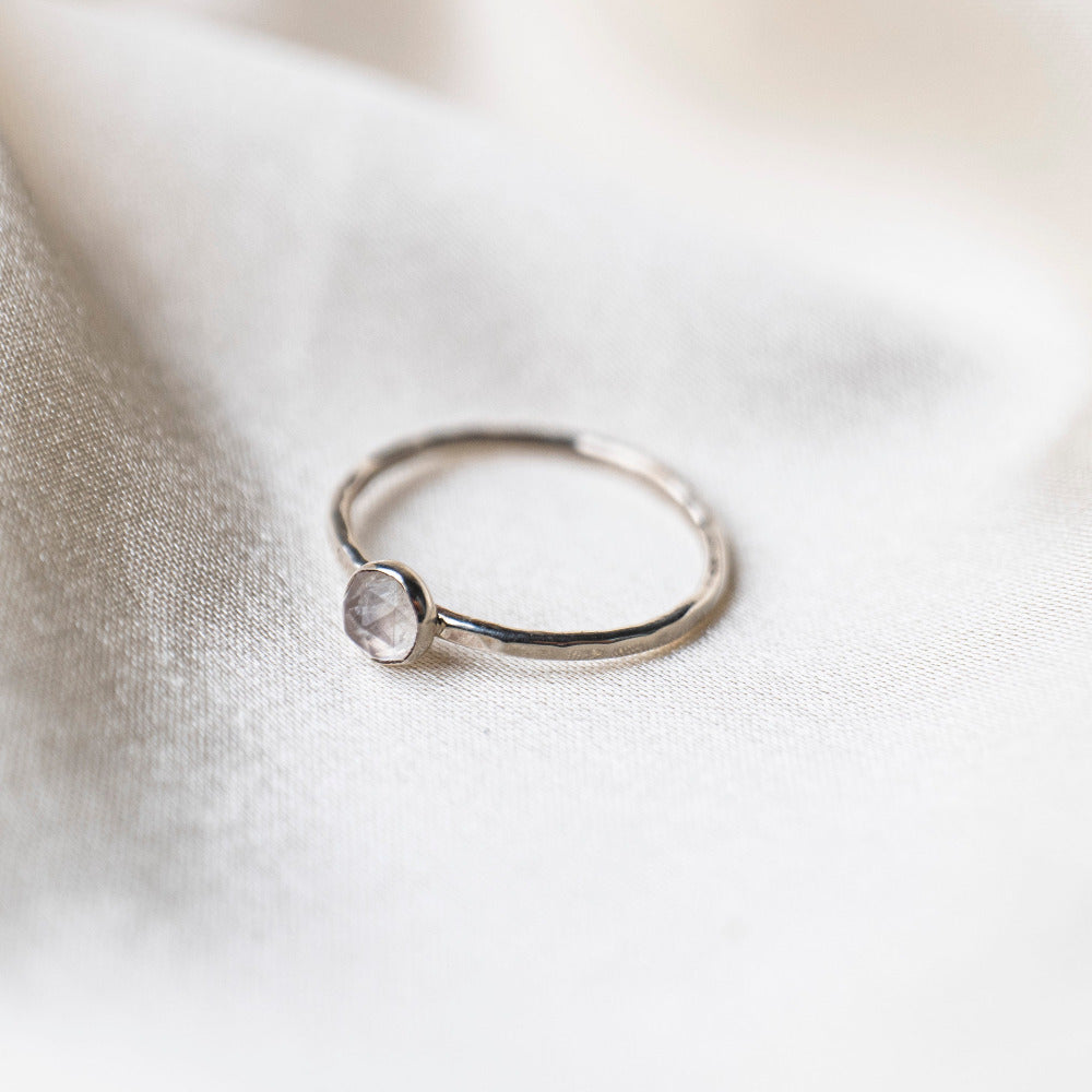 Rainbow Moonstone Rosecut Gemstone, Hammered Ring on a silk background 