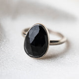 Black Spinel Statement Sterling Silver Ring worn on silk background