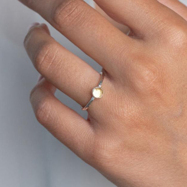 Model wears Citrine Hammered Sterling Silver Stacking Ring , with a white blouse and frenchtip manicured nails.
