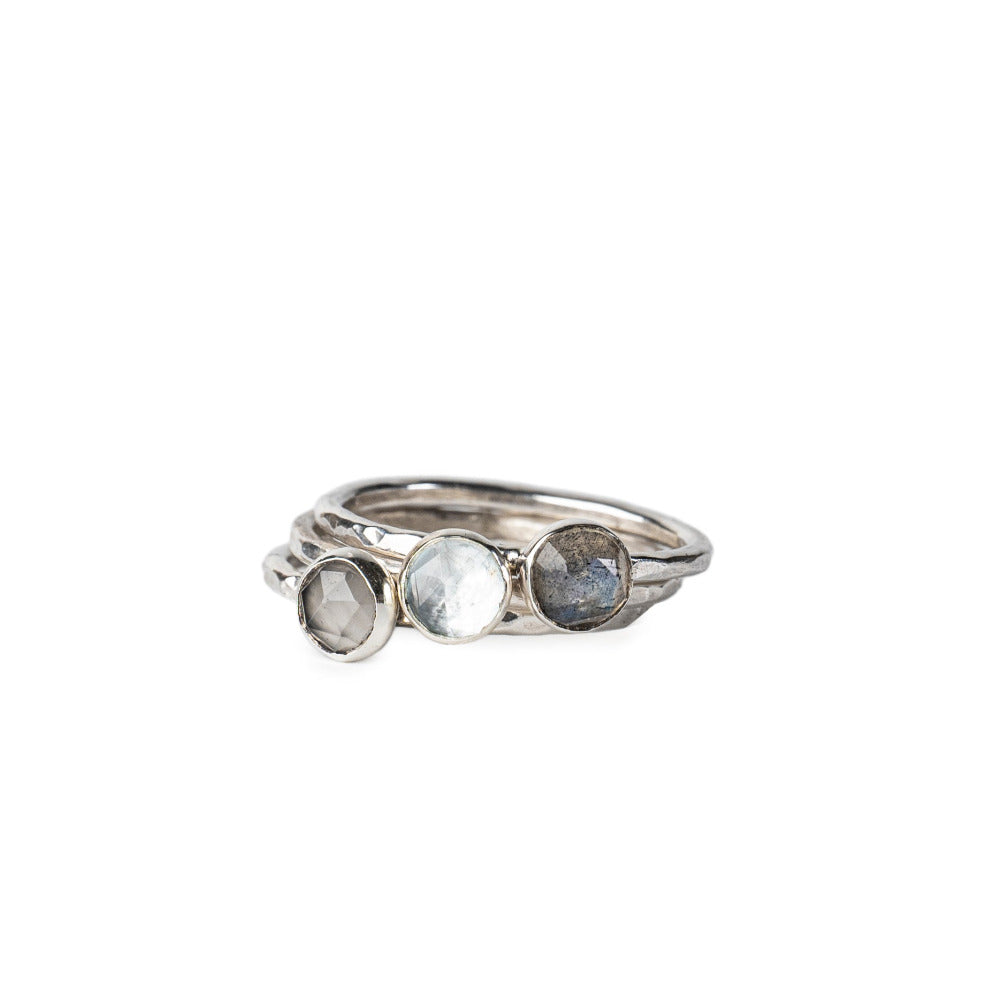 A set of 3 Stacking Rings with gemstones: Labadorite, Aquamarine and Greymoonstone.  Set on Hammered textured Sterling Silver Rings.  Displayed on a white background.