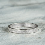 Sterling Silver Hammered textured Ring worn on grey background