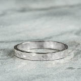 Sterling Silver Hammered textured Ring worn on grey background