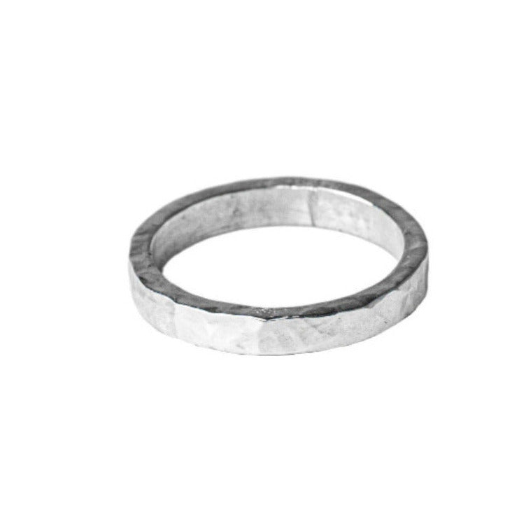 Sterling Silver Hammered textured Ring worn on white background