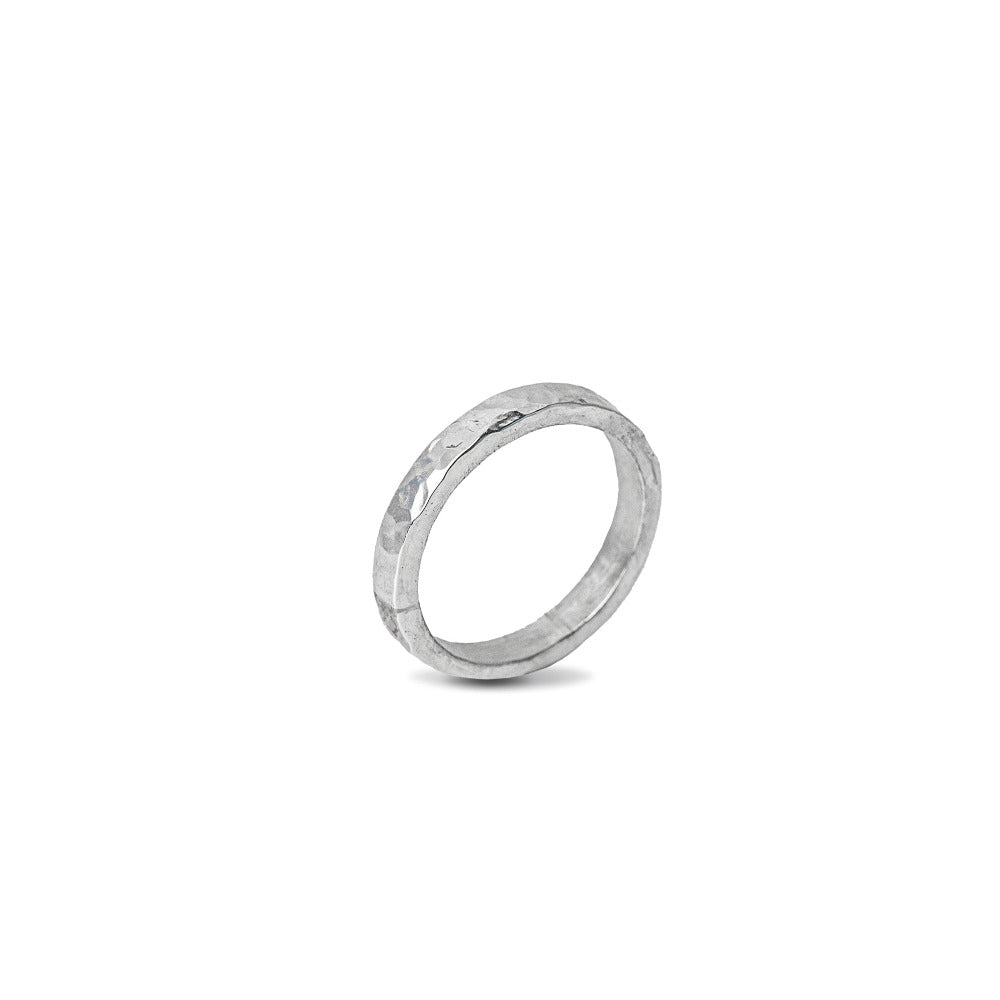 Sterling Silver Hammered textured Ring worn on white background
