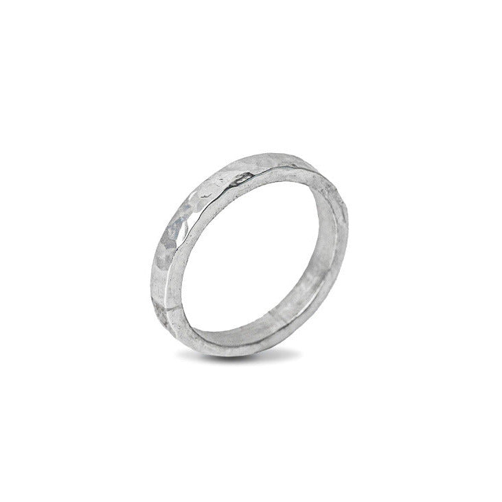 Sterling Silver Hammered textured Ring worn on white background