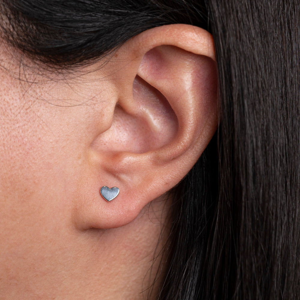 Sterling Silver Heart shaped Earrings worn by model 