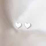 Heart Sterling Silver Earrings on Silk Background