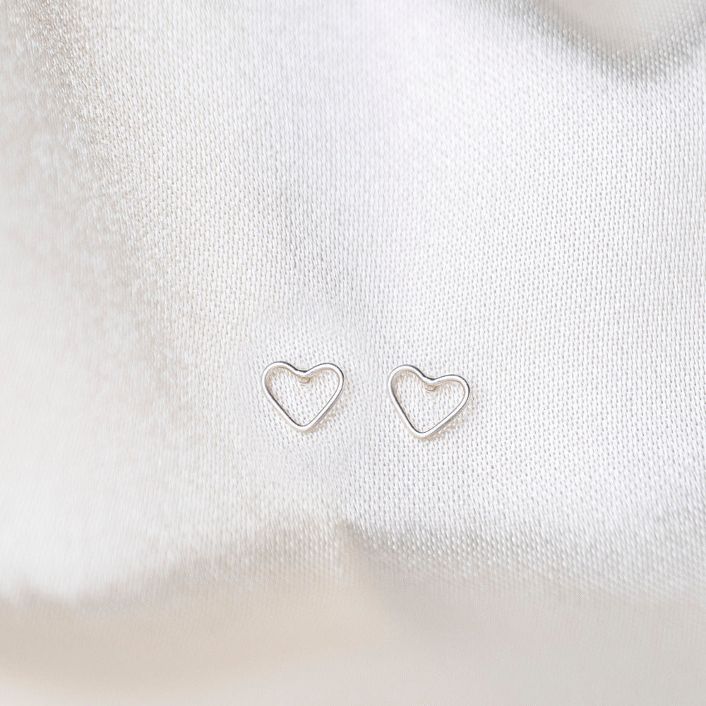 Mini Heart Sterling Earrings Silk Background 