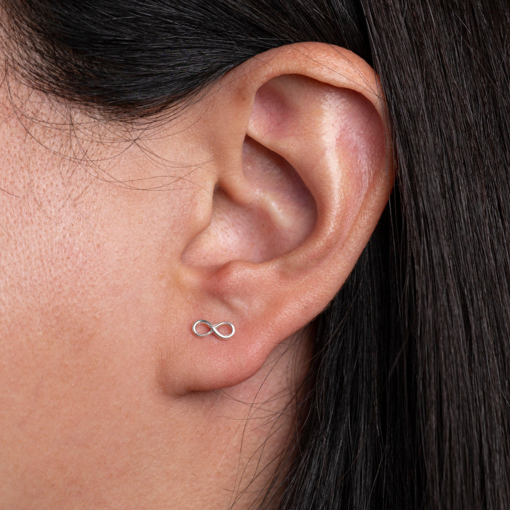 Sterling Silver Infinity shaped Earrings worm by model 