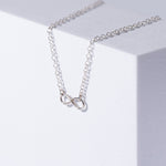 Infinity Sterling Silver Necklace on White Background 