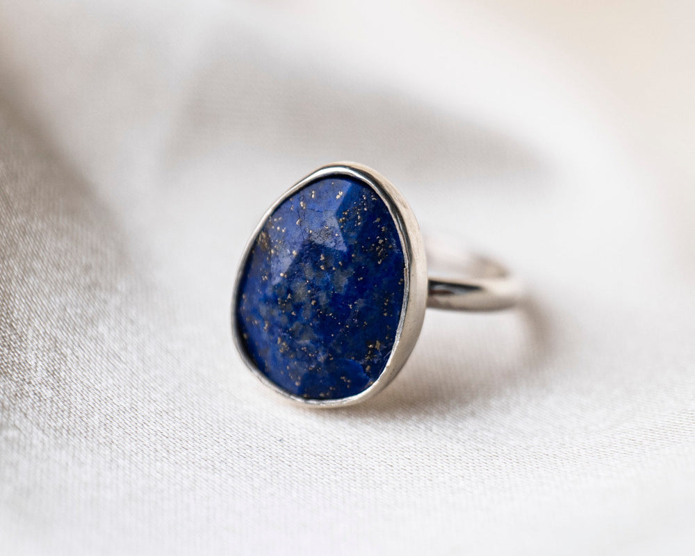 Lapis Gemstone Statement Sterling Silver Ring on silk background 