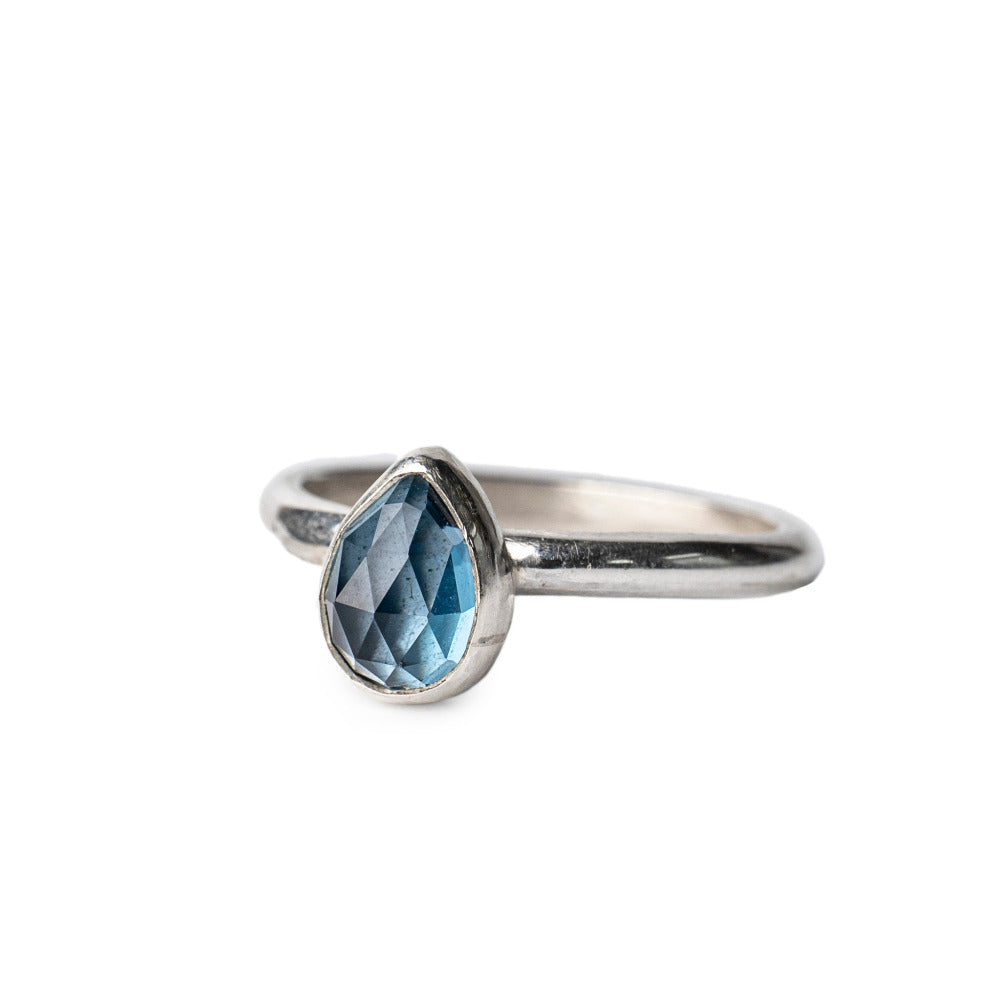 London Blue Topaz Pear shaped Gemstone set on a Court shaped Serling Silver Ring.