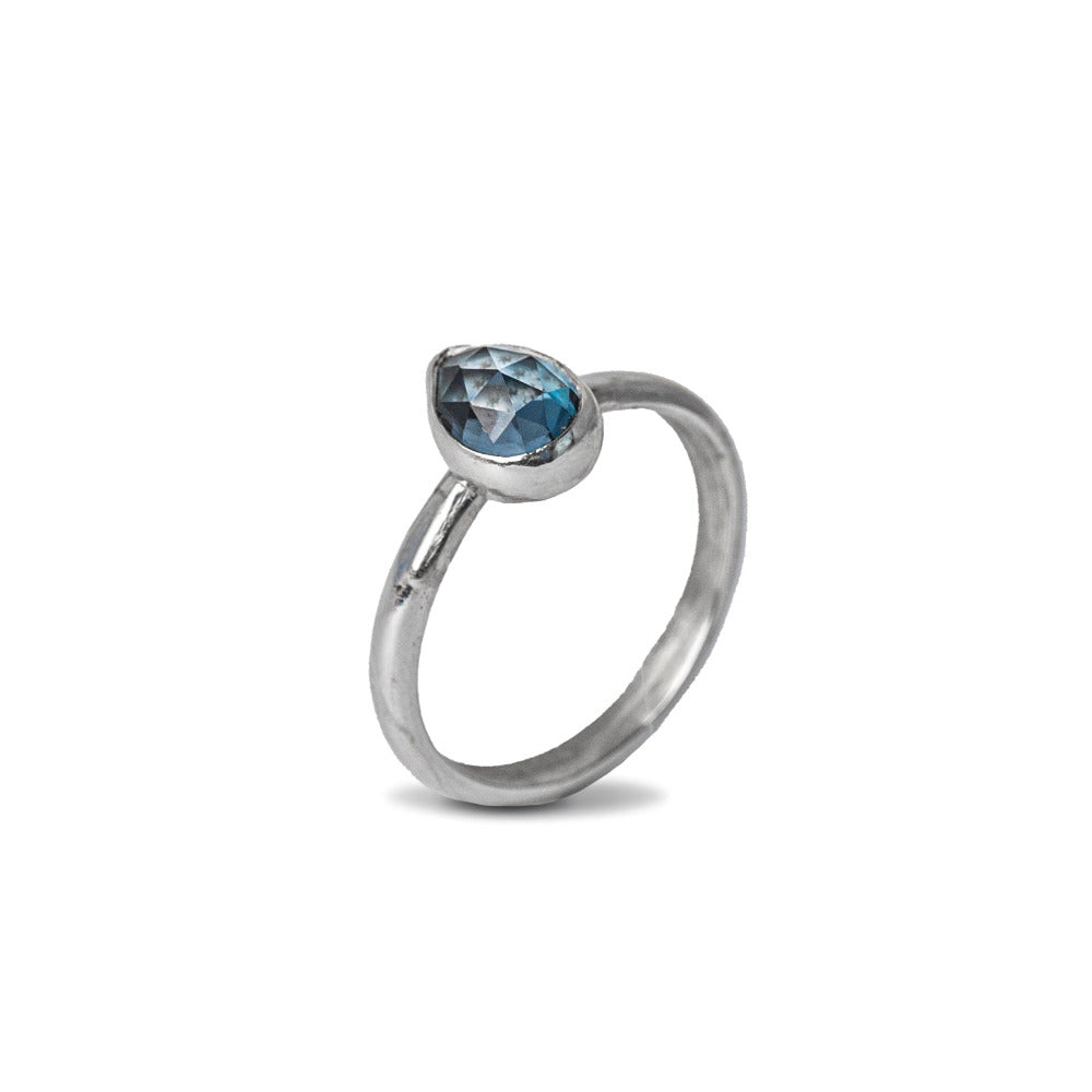 London Blue Topaz Gemstone Prear Sterling Silver Ring on white background 