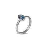 London Blue Topaz Gemstone Prear Sterling Silver Ring on white background 