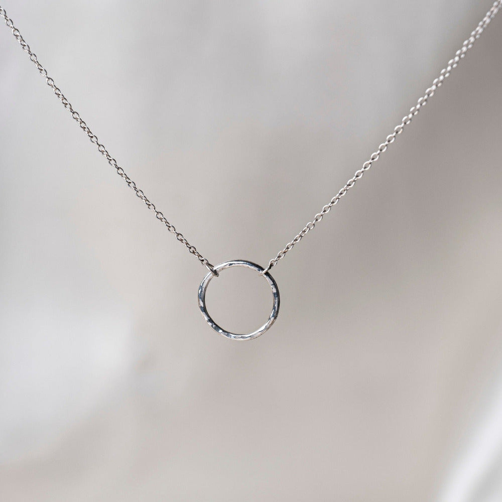 Lunar Sterling Silver Necklae on Silk background 
