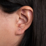 Sterling Silver Mini Heart shaped Earrings worn on model 