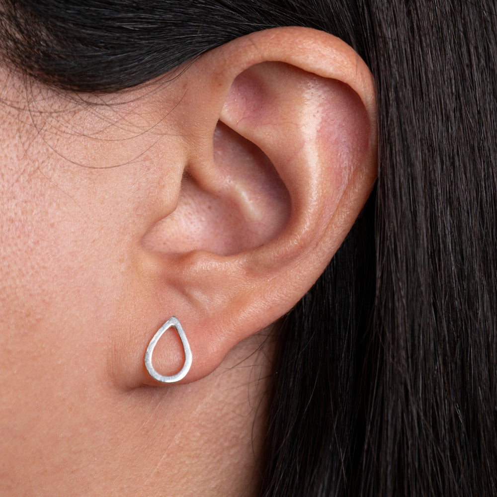 Sterling Silver Pear shaped Earrings worm on models ear lobe 