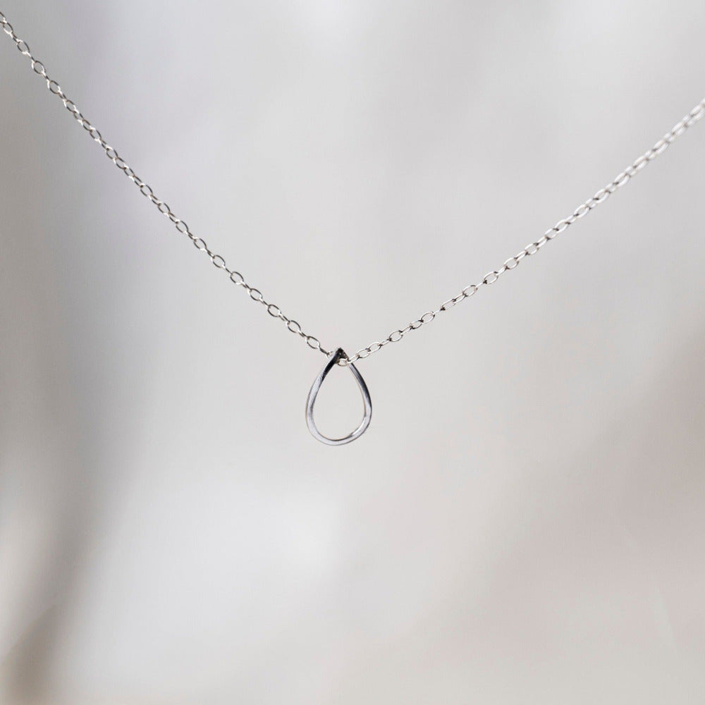 Pear Sterling Silver Necklace Silk background 