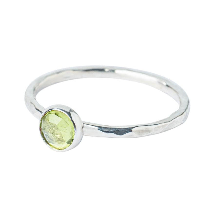 Peridot Gemstone Hammered Texture band, Sterling Silver Ring on a white background 