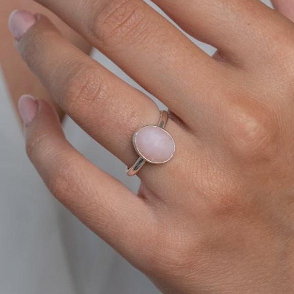 Sterling Silver Pink Opal  Statement Ring worn on model's left hand.