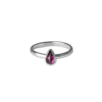 Rhodolite Garnet Gemstone Pear shaped Sterloing Silver Ring worn on white backgrpound 