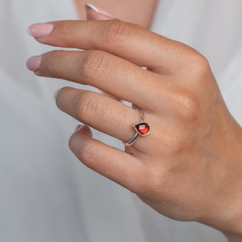 Handmade Sterling Silver Garnet Pear Gemstone Ring worn on a models hand.