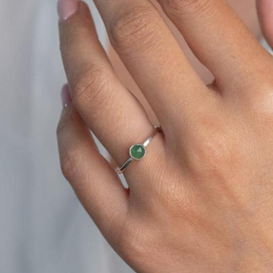 Model wears Jade Hammered Sterling Silver Ring , with a white blouse and frenchtip manicured nails.