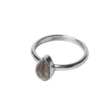 Handmade Labradorite Gemstone Ring in a Pear shape set in Sterling Silver, side front view on a White background.