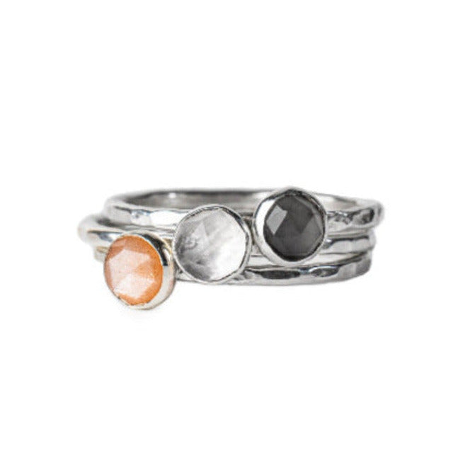 3 Moonstone Gemstone Rings: Grey Moonstone, Peach Moonstone and Rainbow Moonstone.  Set on Hammered Tesxtured Sterling Silver Rings.  Displayd on a White Background background.