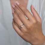 Handmade Sterling Silver Peach Moonstone Pear Gemstone Ring worn on a models hand.