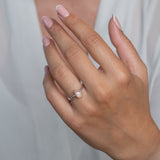 Handmade Sterling Silver Peach Moonstone Pear Gemstone Ring worn on a models hand.