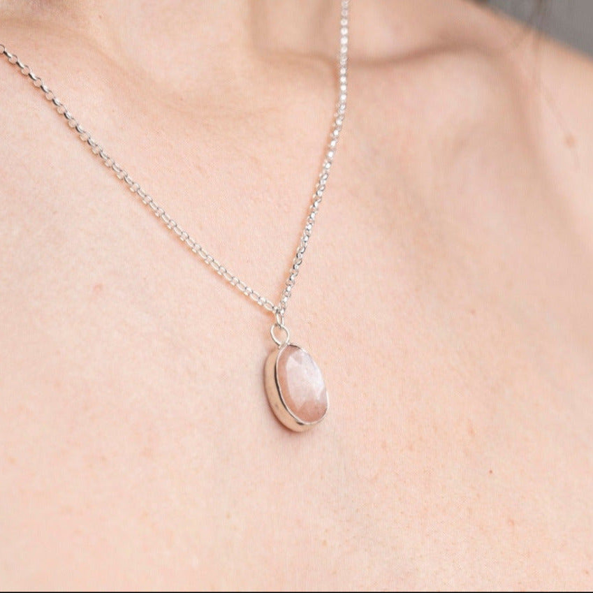 Peach Moonstone Gemstone Pendent Necklace, set in Sterling Silver worn on a model