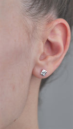 Sterling Silver Hammered Textured Earrings, Square shaped worn in models ear.