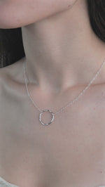 Model wearing Lunar Necklace in a video 