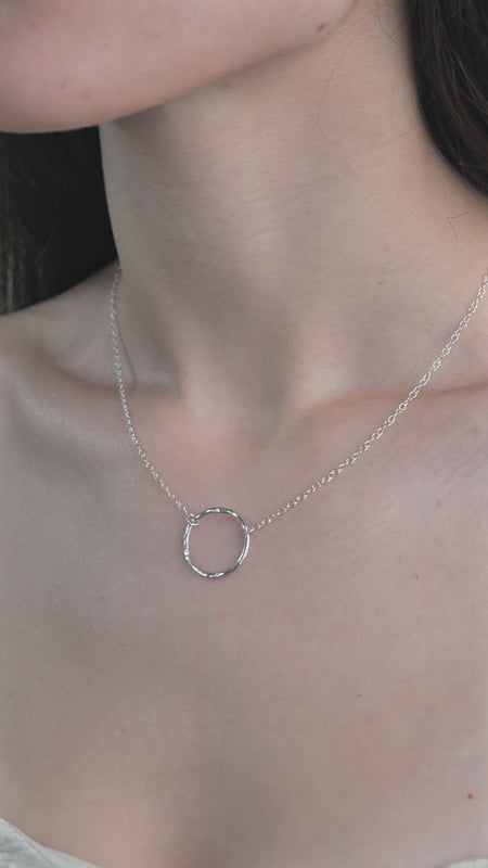 Model wearing Lunar Necklace in a video 