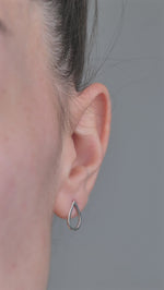Sterling Silver Earrings Pear shaped, worn in models ear 