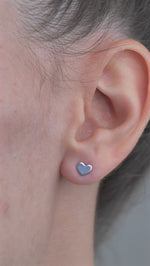 Sterling Silver Hearty Shaped Earrings worn in model's ear.