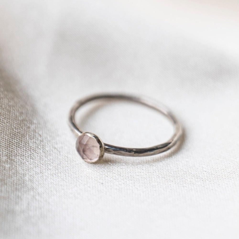 Rose Quartz gemstone Sterling Silver Stacking Ring with Hammered Textured band, shown on a silk background