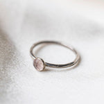Rose Quartz gemstone Sterling Silver Stacking Ring with Hammered Textured band, shown on a silk background