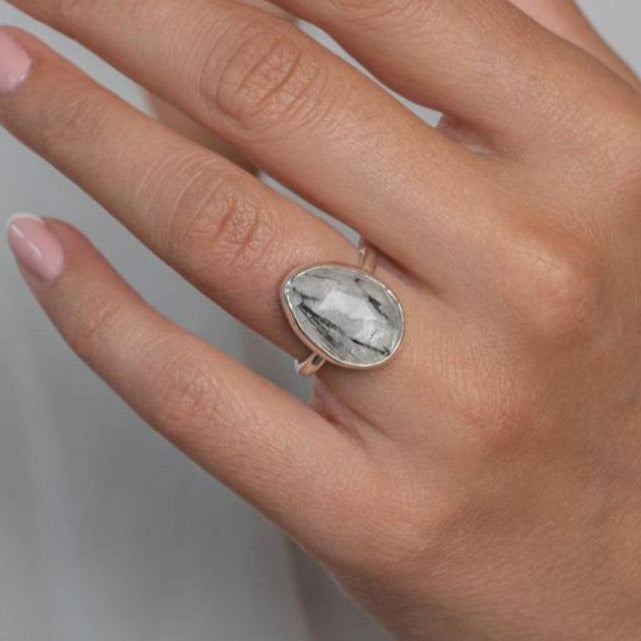 Handmade Sterling Silver Rutilated Black Quartz Statement Ring worn on model's left hand.
